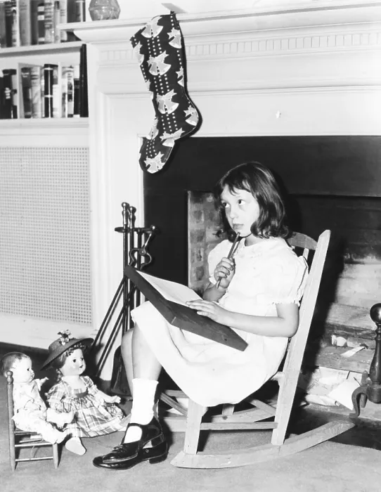 Framed Print : Diana Hopkins, daughter of Harry Hopkins, writing a note to Kris Kringle. She sits before the White House fireplace in a rocking chair given to her by Eleanor Roosevelt Framed Print : Diana Hopkins, daughter of Harry Hopkins, writing a note to Kris Kringle. She sits before the White House fireplace in a rocking chair given to her by Eleanor Roosevelt