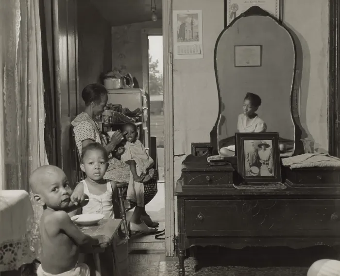 Framed Print : Dinner time at the home of Mrs. Ella Watson, a government charwoman. She feeds the youngest of her three grandchildren in their Washington D.C. apartment