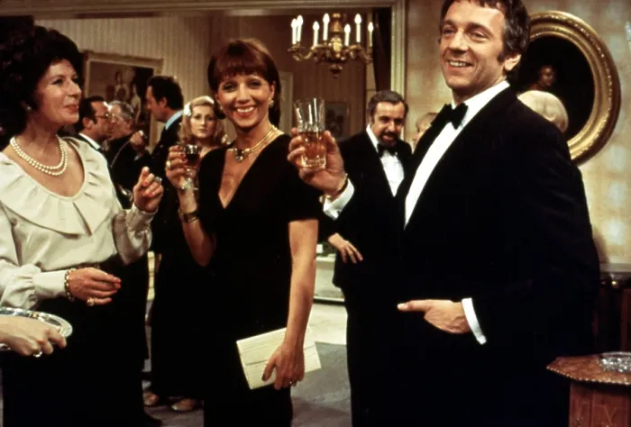 Framed Print : THE DISCREET CHARM OF THE BOURGEOISIE, (aka LE CHARME DISCRET DE LA BOURGEOISIE), Stephane Audran (center, black dress), Fernando Rey (background, goatee)