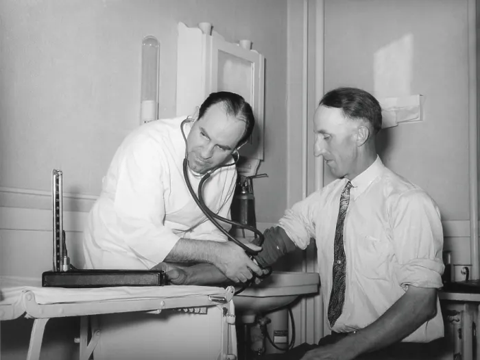 Framed Print : Doctor at a medical cooperative taking blood pressure of a patient in Box Elder County, Utah, 1940