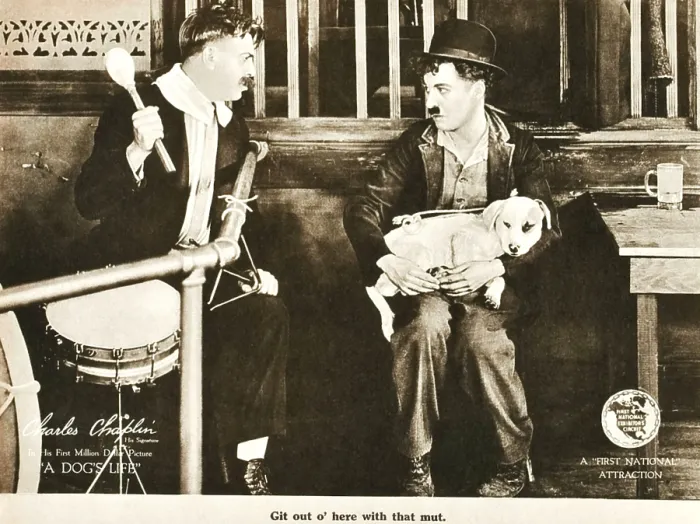 Framed Print : A DOG'S LIFE, right: Charlie Chaplin; dog on lap: Mut'; on lobbycard, 1918