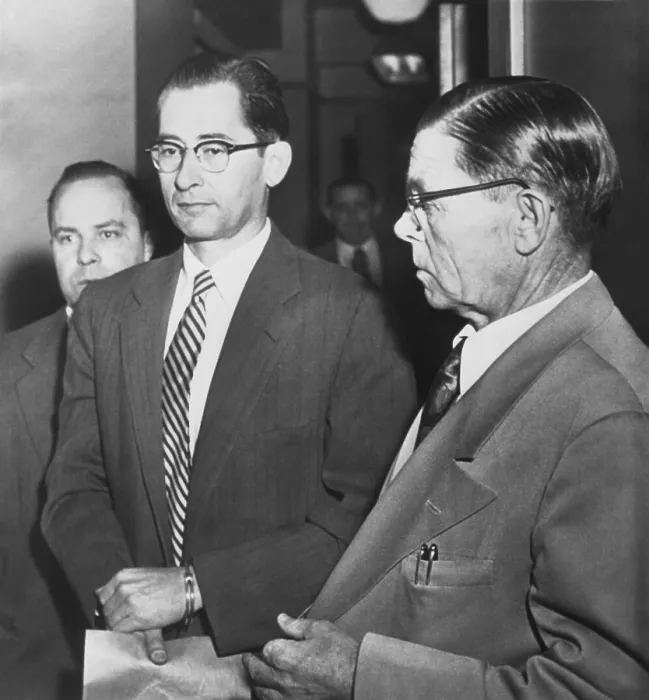 Framed Print : Dr. Albert Blumberg, an accused and admitted Communist, in handcuffs, Oct. 20, 1954