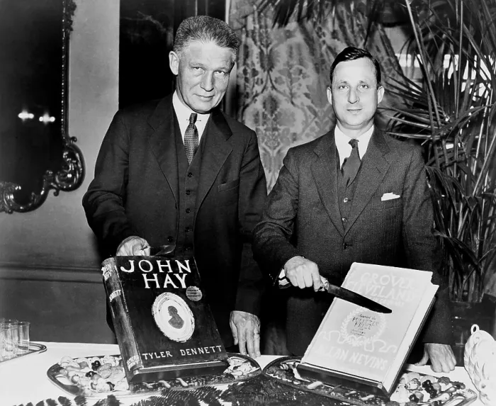 Framed Print : Dr. Allan Nevins (1890-1971) and Tyler Dennett (1883-1949), both historians, celebrate their 1934 Pulitzer Prizes with cakes made to look like each of their books