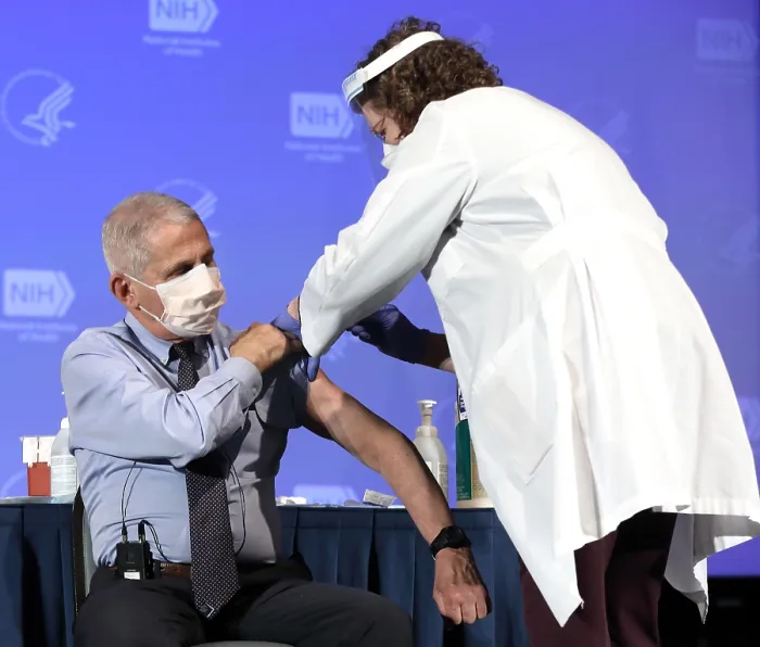 Framed Print : Dr. Anthony Fauci, rolls up his sleeve to publicly receive the Moderna COVID-19 vaccine, Dec. 22, 2020 (BSLOC_2021_1_18)