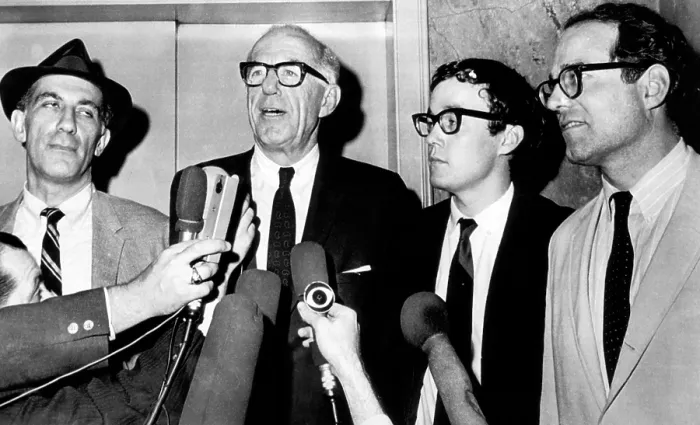 Framed Print : Dr. Benjamin Spock (second from left), American pediatrician and author, talks to newsmen after convicted by a Federal jury of conspiring to counsel young men to evade the draft
