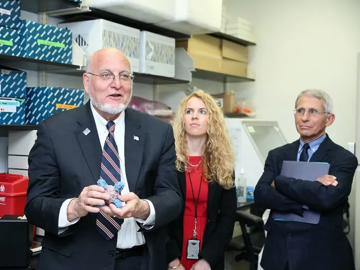 Framed Print : Dr. Robert Redfield learns about universal flu vaccine development at the Vaccine Research Center of the NIH, June 12, 2018. At right is Dr. Anthony Fauci, Director of NIAID