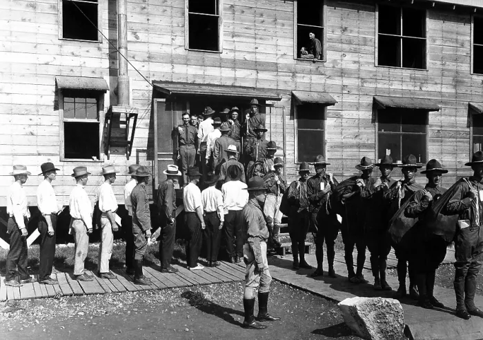 Framed Print : Drafted men reporting for service at Camp Travis, San Antonio, Texas. They enter the base building in the civilian clothing, but leave in their new uniforms. World War I. Ca