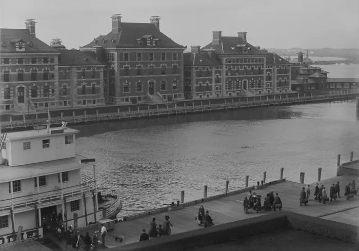 Framed Print : Well dressed immigrants arriving via Ferry at New York's Ellis Island. Ferries transported passengers from their Ocean going ship to the immigrant inspection station. Ca. 1910 Framed Print : Well dressed immigrants arriving via Ferry at New York's Ellis Island. Ferries transported passengers from their Ocean going ship to the immigrant inspection station. Ca. 1910