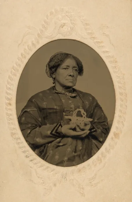 Framed Print : Well dressed middle aged, African American women holding a basket in the Post Civil War era. Ca. 1870 Framed Print : Well dressed middle aged, African American women holding a basket in the Post Civil War era. Ca. 1870