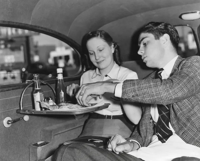 Framed Print : Drive-in restaurant in Hollywood, Los Angeles. June 29, 1938. California couple enjoying lunch in the back seat of their car