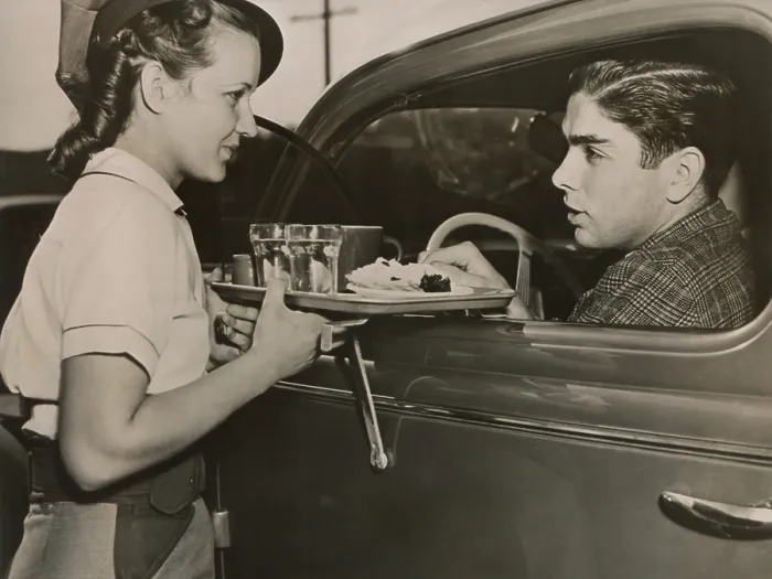 Framed Print : Drive-in restaurant in Hollywood, Los Angeles. June 29, 1938. Waitress brings food to drivers who do not have time to stop at a restaurant. - (BSLOC_2014_17_114) Framed Print : Drive-in restaurant in Hollywood, Los Angeles. June 29, 1938. Waitress brings food to drivers who do not have time to stop at a restaurant. - (BSLOC_2014_17_114)