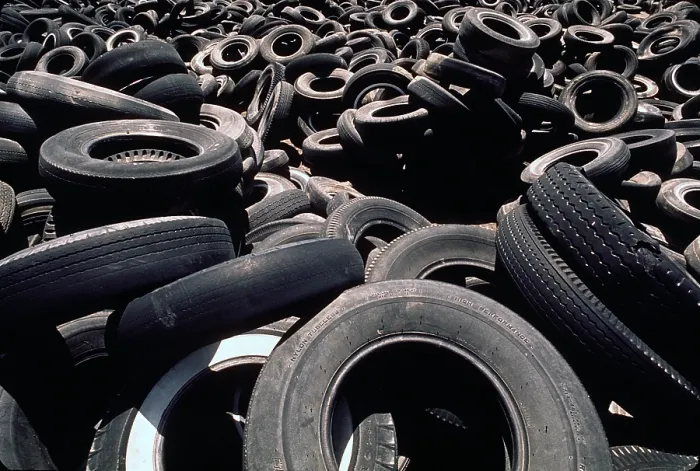 Framed Print : Dump of discarded automobile tires that are to be burned creating a pollution smoke hazard. Ca. 1973-75