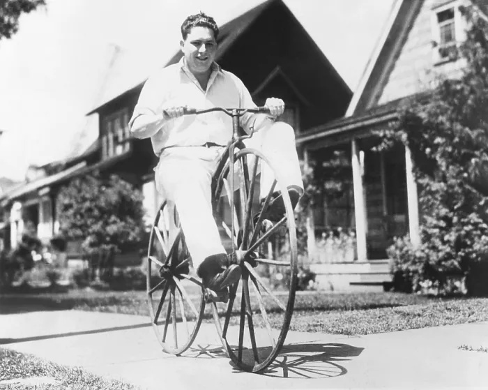 Framed Print : Dwight Hardwick riding a hand made bicycle built by his grandfather in Minnesota in 1838. It is peddled on the front wheel and made with ordinary buggy wheels