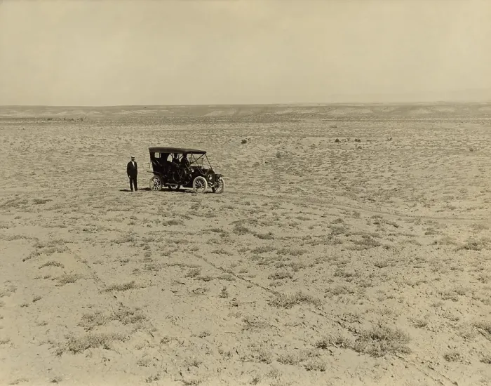 Framed Print : Early automobile parked in an expansive area of barren land in the Grand Valley, Mesa County, Colorado, c. 1912