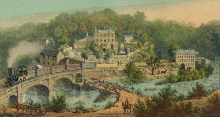Framed Print : Early railroad crossing a bridge in front of the Chester Mill, established in 1831, in the town of Ellicott Mills, Maryland