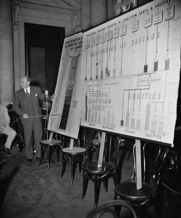 Framed Print : Economist Donald Davenport reports to Monopoly Committee. His charts show that five North Eastern states have $ 37.8 billion of dollars laid up in savings, 67% of U.S. total Framed Print : Economist Donald Davenport reports to Monopoly Committee. His charts show that five North Eastern states have $ 37.8 billion of dollars laid up in savings, 67% of U.S. total