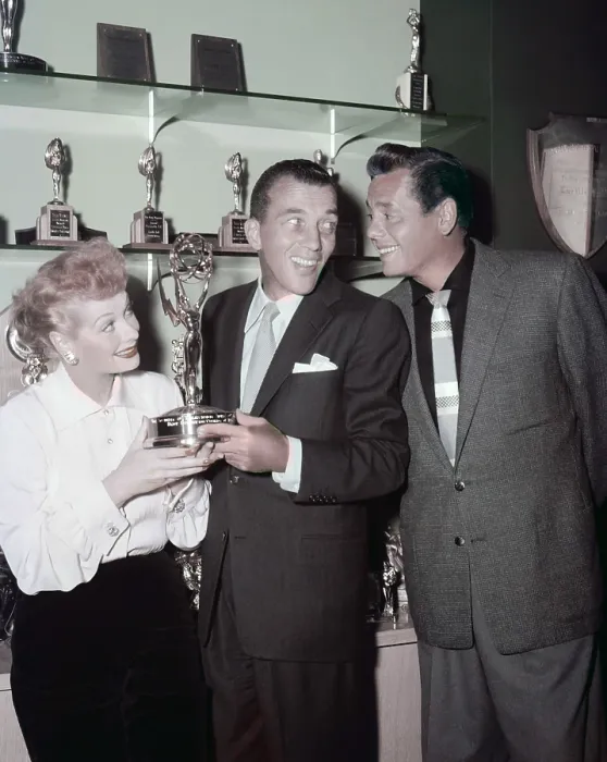 Framed Print : Ed Sullivan (center) admiring the trophy shelf of Lucille Ball and Desi Arnaz, ca. mid-1950s