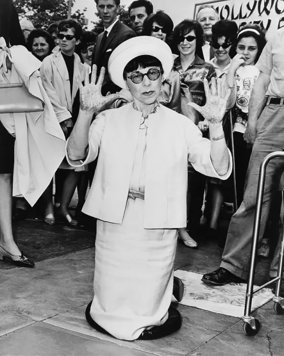 Framed Print : Edith Head, leaving hand prints in cement outside the Hollywood Pavilion in 1964. She won eight Academy Awards for her movie costume design Framed Print : Edith Head, leaving hand prints in cement outside the Hollywood Pavilion in 1964. She won eight Academy Awards for her movie costume design