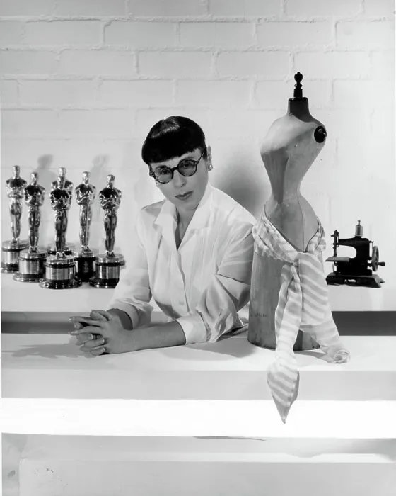 Framed Print : EDITH HEAD, posing with Oscars she has won, c. 1960.. Courtesy: CSU Archives  /  Everett Collection