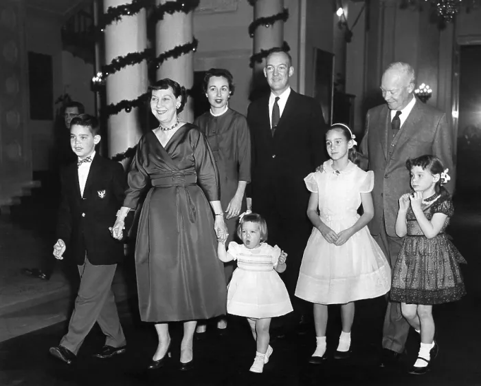 Framed Print : Eisenhower family Christmas at the White House. L-R: David, the First Lady, Barbara, Mary Jean, John, Barbara Ann, the President, and Susan. Ca. 1958. - (BSLOC_2014_16_112)