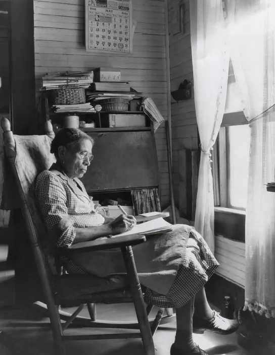 Framed Print : Elderly African American woman writing in a rocking chair, Putnam, Georgia, May 1941. (BSLOC_2013_8_126)