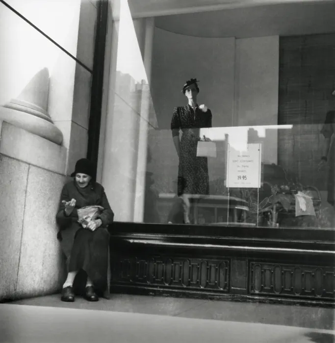 Framed Print : Elderly woman beggar selling pencils during the Great Depression, 1938. She is sheltered against an urban dress shop window