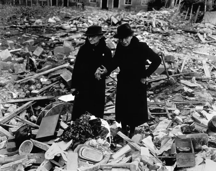 Framed Print : Two elderly women stand amid the ruins of the Almshouse that had been their home. The Germans bomber Newbury, Berkshire, England on Feb. 10, 1943. World War 2. (BSLOC_2014_10_59)