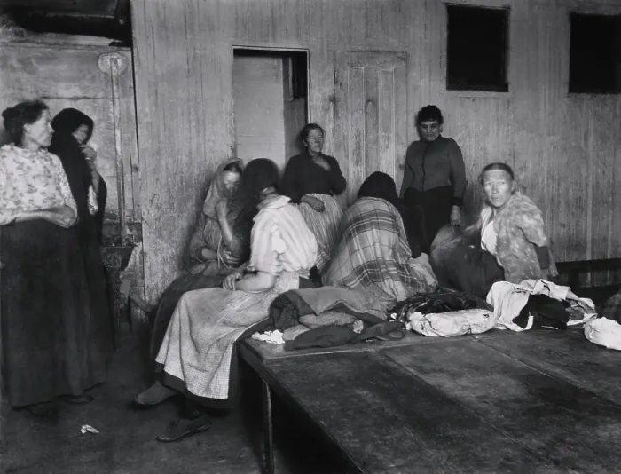 Framed Print : ELDRIDGE STREET POLICE STATION LODGERS, by Jacob Riis, c. 1890. Homeless women sit on plank beds where the lucky ones will sleep above the floor (BSLOC_2018_1_104)