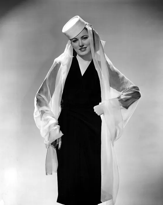 Framed Print : ELEANOR PARKER wearing a pill box hat and chiffon drape. 1943