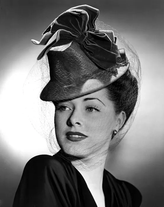 Framed Print : ELEANOR PARKER wearing a tall crowned chapeua made of felt with velvet bows, 1943 Framed Print : ELEANOR PARKER wearing a tall crowned chapeua made of felt with velvet bows, 1943