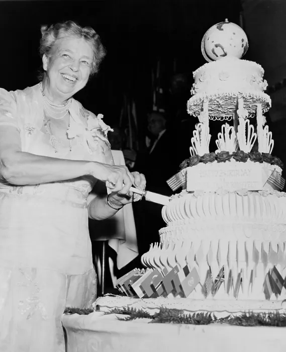 Framed Print : Eleanor Roosevelt celebrates her 70th birthday. Oct. 17, 1955. She cuts her cake at a dinner held by the American Association of the United Nations. Hotel Roosevelt, NYC