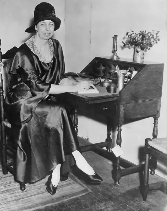 Framed Print : Eleanor Roosevelt in New York City. 1932. She is writing at a desk, dressed in a silk dress with lace collar, cloche hat, and pumps. (BSLOC_2013_5_204) Framed Print : Eleanor Roosevelt in New York City. 1932. She is writing at a desk, dressed in a silk dress with lace collar, cloche hat, and pumps. (BSLOC_2013_5_204)