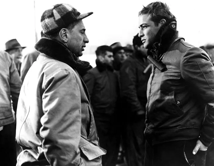 Framed Print : ELIA KAZAN directs MARLON BRANDO on location during production of ON THE WATERFRONT, 1954