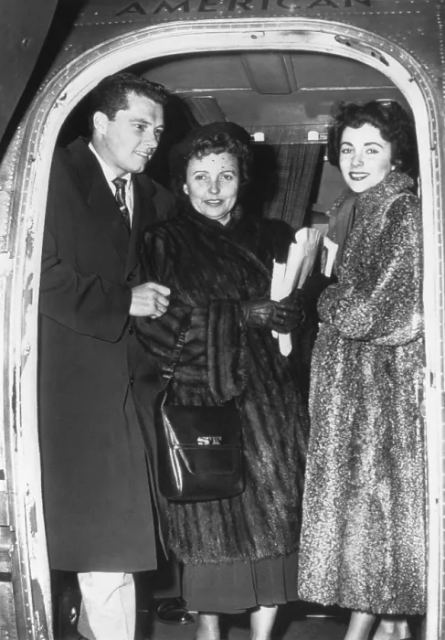 Framed Print : Elizabeth Taylor (right) and her fiance, Nicky Hilton Jr. arrive in Chicago with her mother. March 2, 1950. - (BSLOC_2014_17_98)
