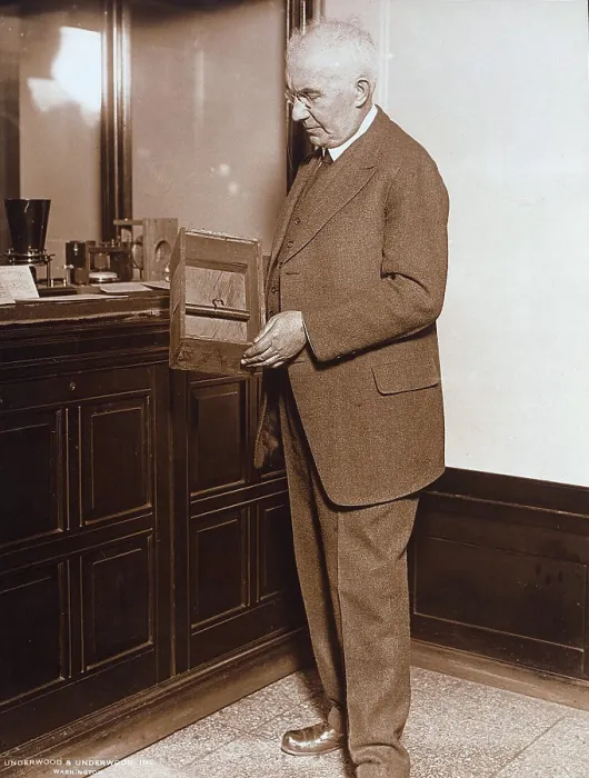 Framed Print : Emile Berliner (1851-1929), American inventor of the phonograph, holding a microphone first used on April 8, 1877, circa 1910s