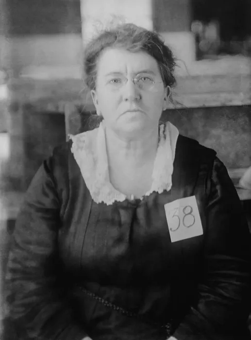 Framed Print : Emma Goldman, wearing 38 tag while government custody, ca. 1917-20
