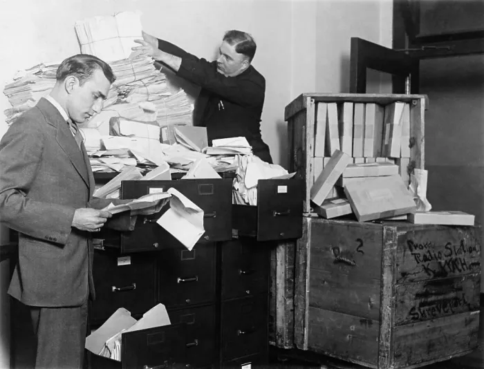 Framed Print : Two employees of the Federal Radio Commission overwhelmed by piles of mail in 1929