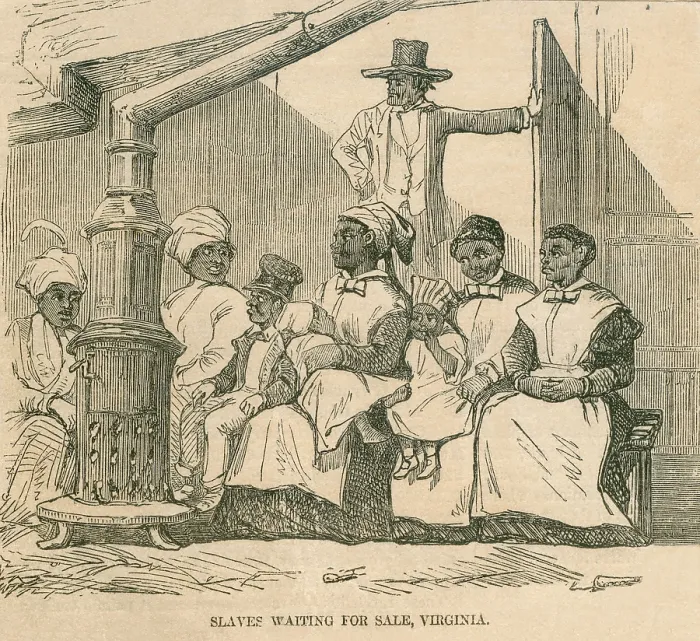 Framed Print : Enslaved African American women with their children gather sit near a stove as they await being auctioned in Richmond, Virginia in 1856