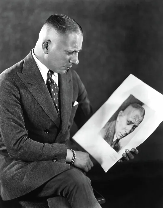 Framed Print : Erich von Stroheim looking at a picture of himself, 1924