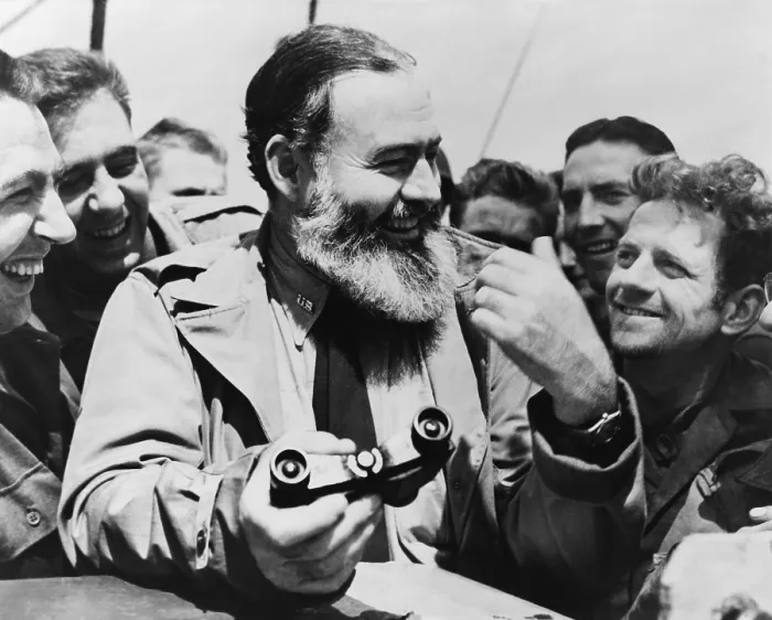 Framed Print : Ernest Hemingway, holding binoculars and surrounded by admirers, 1959. He had recently completed THE MOVEABLE FEAST, his memoir of Paris in the 1920s (BSLOC_2016_11_149)