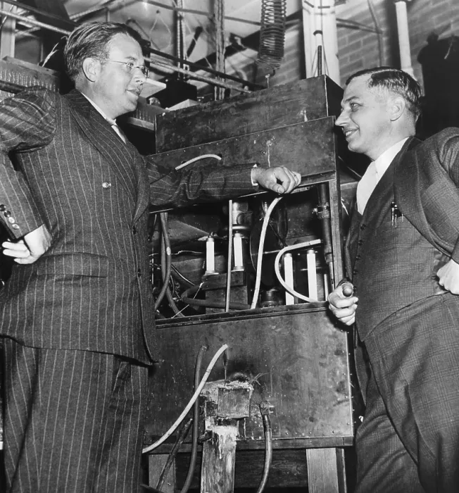 Framed Print : Ernest O. Lawrence, American physicist and Nobel Laureate, and Dr. Lee Alvin DuBridge (1901-1994), inspecting an atom smasher at the University of Rochester in Rochester NY