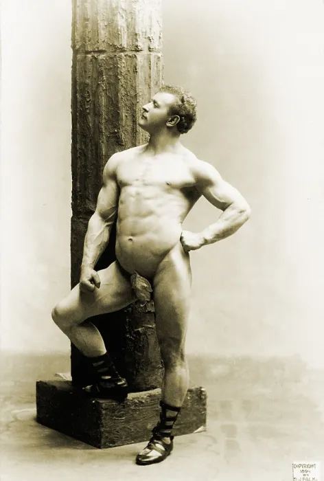 Framed Print : Eugen Sandow (1867-1925), the first professional body builder, standing nude by column. 1894