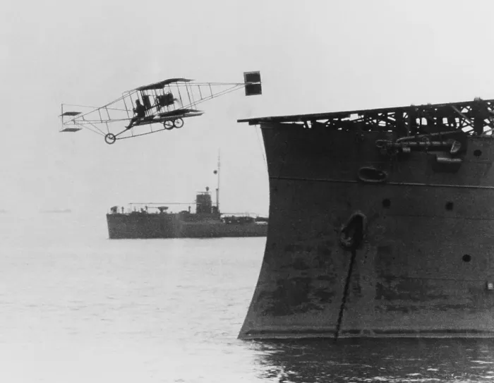 Framed Print : Eugene B. Ely flies his Curtiss pusher airplane from USS Birmingham, Nov. 14, 1910. It was the first airplane to takeoff from a warship