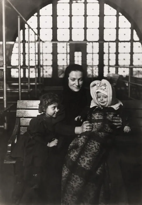 Framed Print : European immigrant mother with two young children at Ellis Island, c. 1908