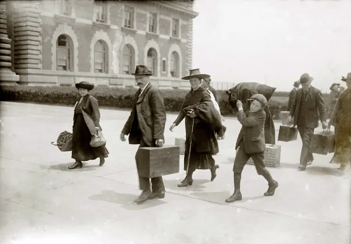 Framed Print : European immigrants arriving at Ellis Island, ca. 1920, some of the last to enter after World War I, when the United States set national quotas greatly reducing immigration. 1920