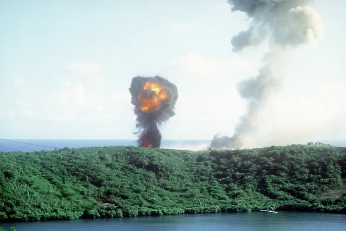 Framed Print : Explosion from a direct U.S. hit on a Grenadian position on the first day of the U.S. lead invasion of the Caribbean island on Oct. 25 1983. (BSLOC_2011_3_6)