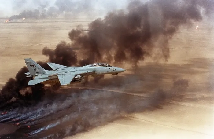 Framed Print : F-14 fighter in flight over burning Kuwaiti oil wells set on fire in March by retreating Iraqi forces were still burning on Aug. 1 1991