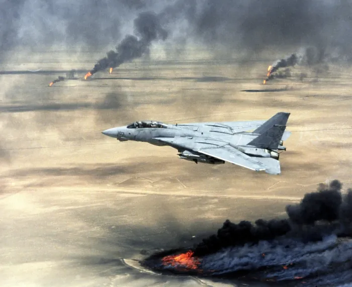 Framed Print : F-14 fighter in flight over burning Kuwaiti oil wells set on fire by retreating Iraqi forces during Operation Desert Storm. Mar. 1 1991 (BSLOC_2011_12_19)