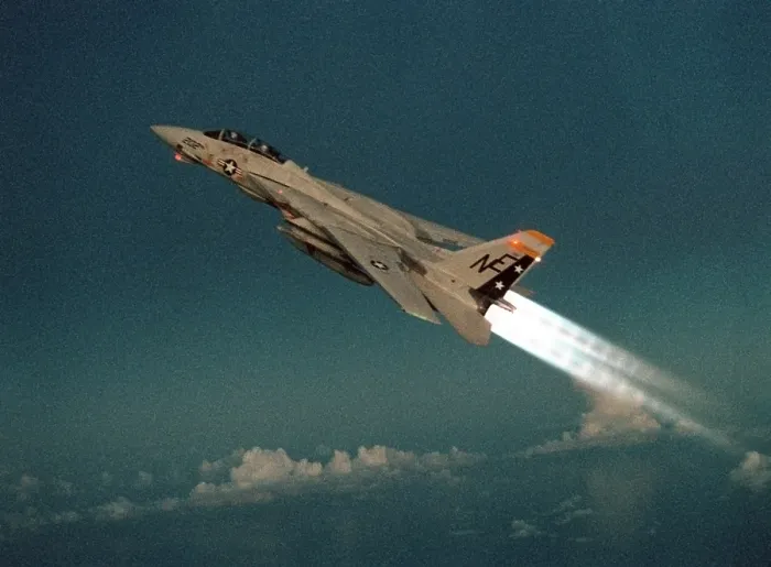 Framed Print : F-14 Tomcat Fighter climbs with its afterburners ignited during a take-off of the aircraft carrier USS RANGER. May 1 1989. (BSLOC_2011_12_216)