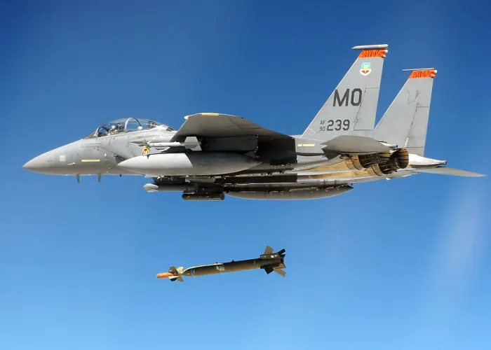 Framed Print : F-15 Strike Eagle Fighter drops a Guided Bomb during a combat exercises at Hill Air Force Base Utah. Ca. 1980s. (BSLOC_2011_12_215)